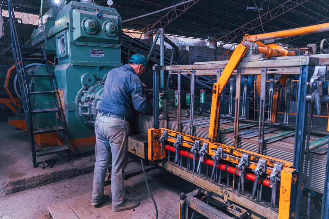 Metalworking in a factory; illustrative stock photograph